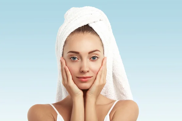 female with bath towel on head