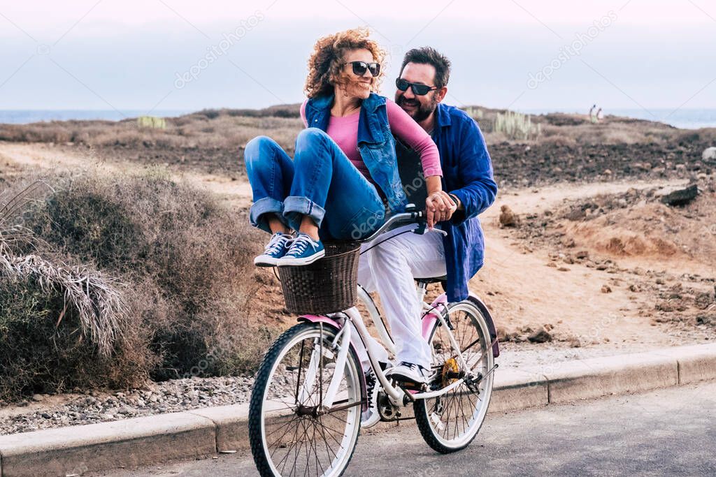 Young couple having fun in outdoor road leisure activity together 