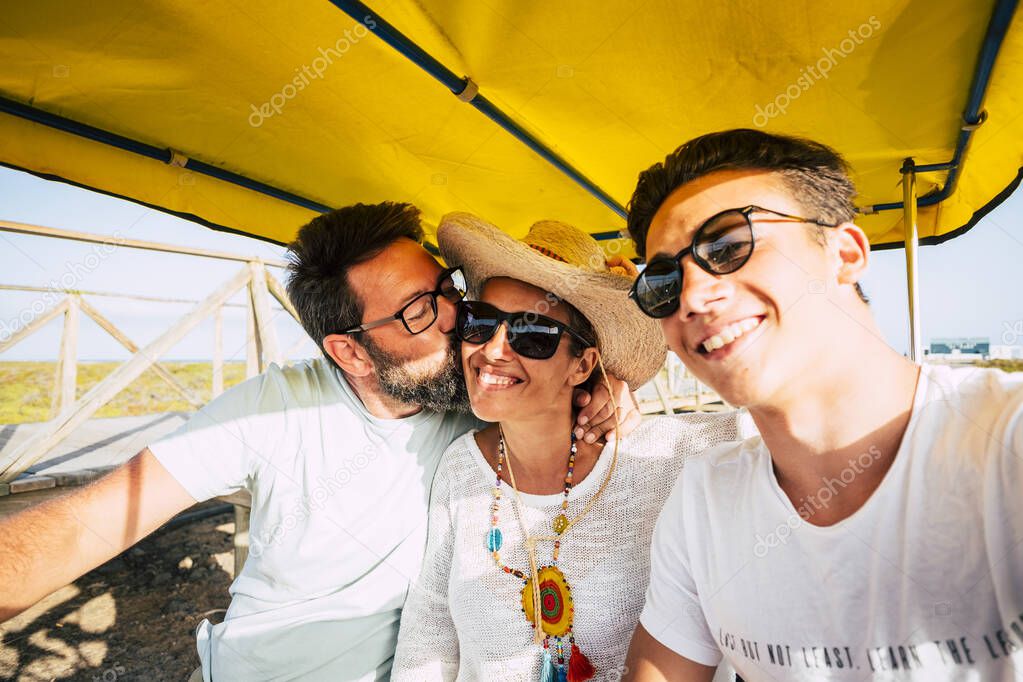 Happy young family have fun together and enjoy outdoor leisure activity in sunny day of summer
