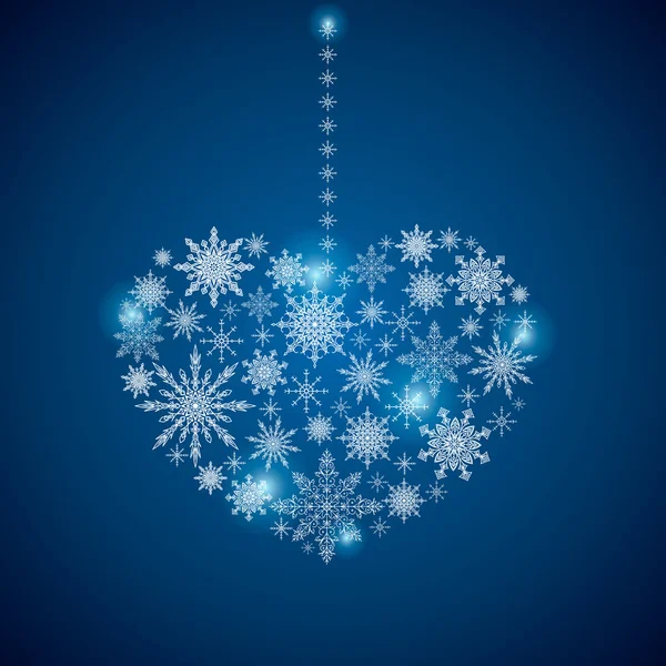 Stock heart of a large set of snowflakes on a blue background — Stock Vector