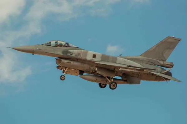 Fighter plane landing with landing gear lowered