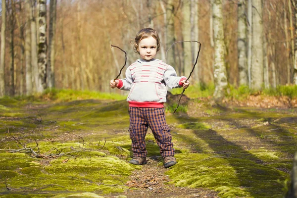 The child with the sticks to walk. — Stock Photo, Image