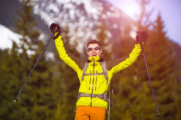 Portrait of mountaineer with mountains in the background. — Stock Photo, Image