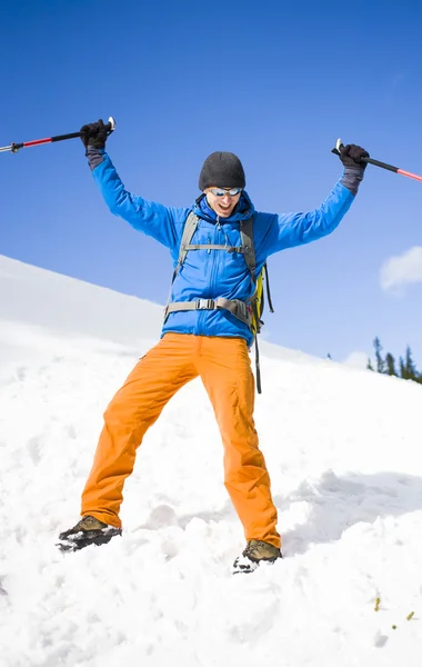 Portrait of mountaineer with mountains in the background. — Stock Photo, Image