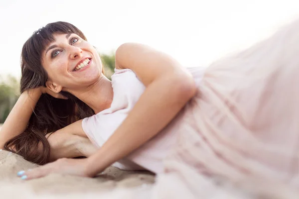 Young Happy Girl Light Dress Lies Sand Laughs Joy — Stock Photo, Image