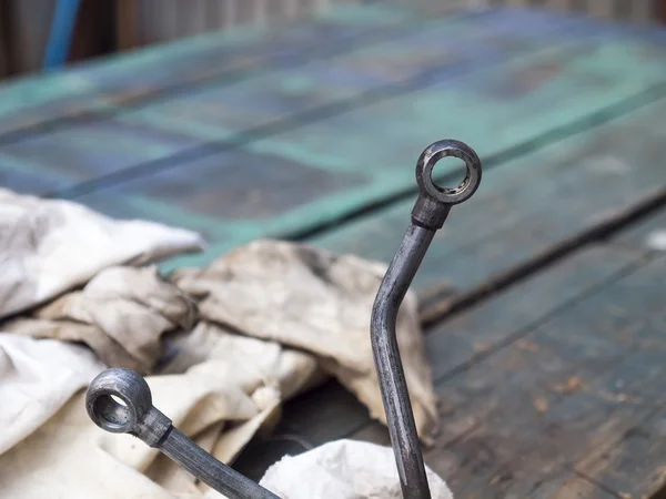 The metal hinge on the background of the table. — Stock Photo, Image