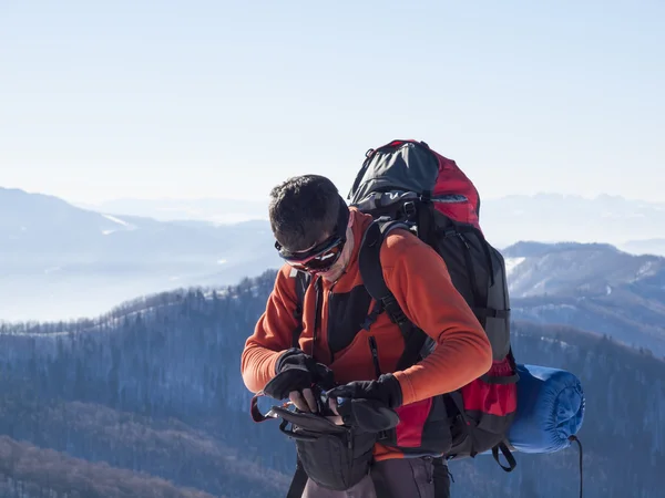 Climber hiding a camera in the bag. — Stock Photo, Image