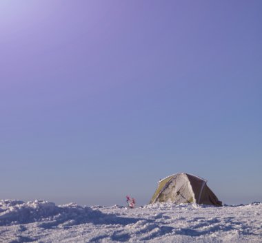 Snowshoes tent and stood in the snow.