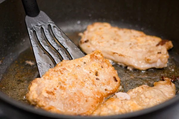 Pork chop on frying pan — Stock Photo, Image