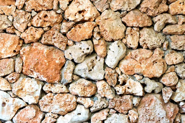 Fundo de uma parede construída de pedras — Fotografia de Stock