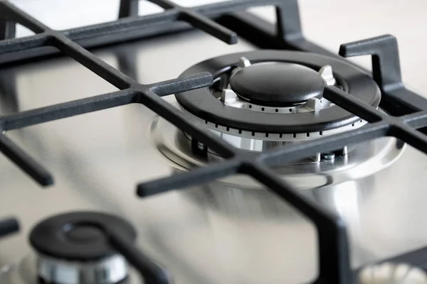 Large double gas burner on the modern stainless gas hob