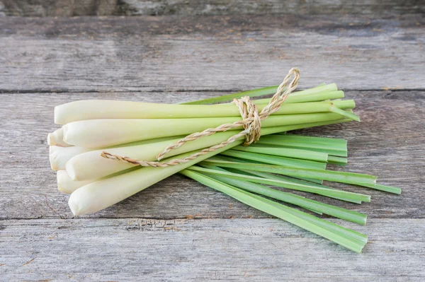 Fresh lemongrass (citronella) on wooden background - Spice for h — Stock Photo, Image