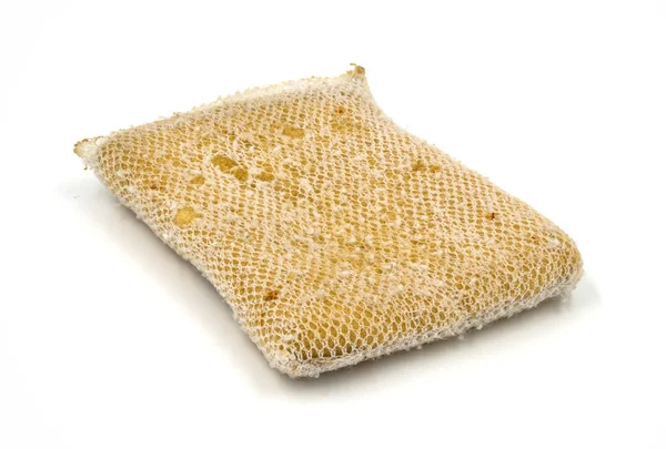 Old kitchen sponge on white background. — Stock Photo, Image