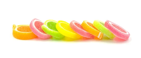Jelly édes, ízletes gyümölcs, édesség desszert színes fehér háttér. — Stock Fotó