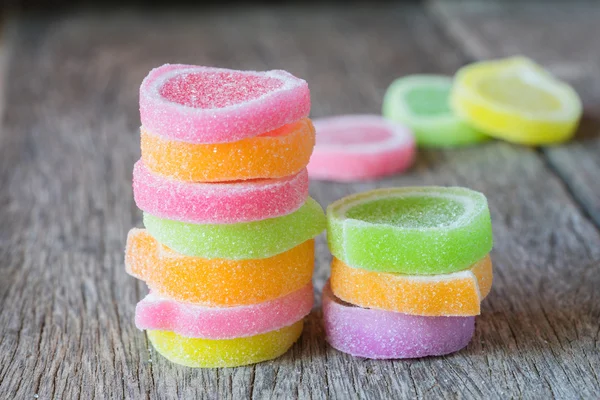 Jelly sweet, flavor fruit, candy dessert colorful on wood backgr — Stock Photo, Image