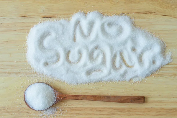 Wo üzerinde beyaz toz şeker yığını içine yapılan yazıt şeker — Stok fotoğraf