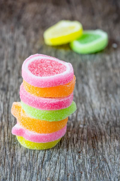 Jelly sweet, flavor fruit, candy dessert colorful on wood backgr — Stock Photo, Image