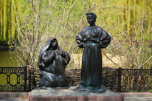 Mirgorod or Myrhorod, Ukraine - May 3, 2021: Sculptures of the famous Mykola Gogol characters from the book "Evenings on a Farm Near Dikanka"