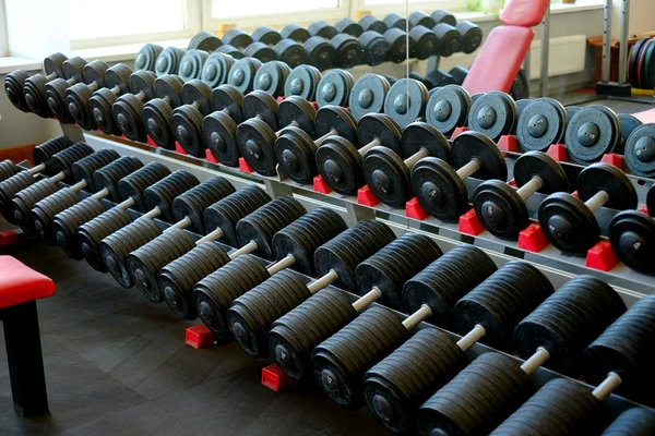 Dumbbells in modern sports club — Stock Photo, Image