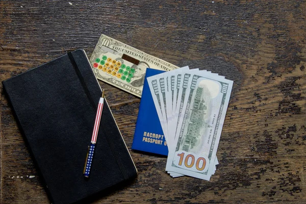 Calculator and notepad Passport pen dollar — Stock Photo, Image