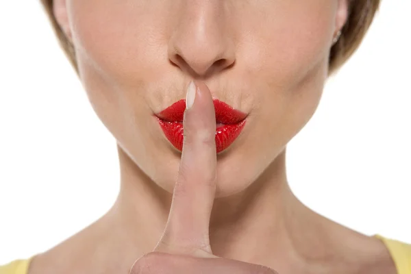 Finger on lips requiring silence — Stock Photo, Image