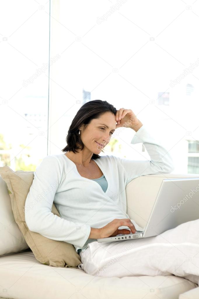 Woman using pc at home