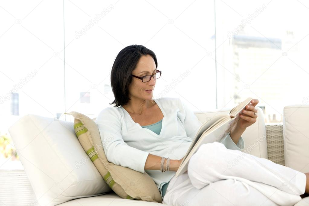 Womman reading a book at home