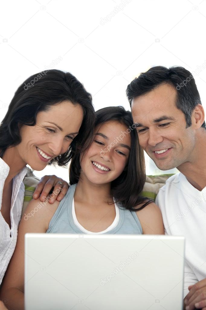 Family with one kid using laptop