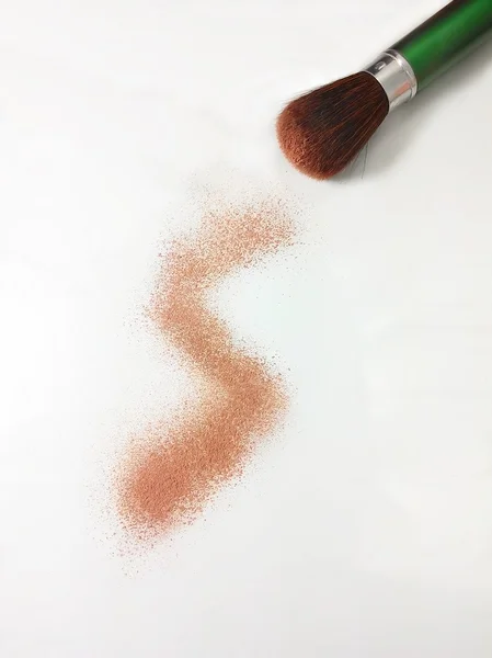 Cosmetic powder on white