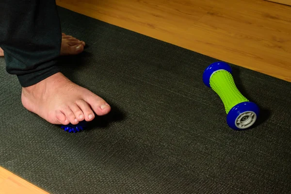 Man doing rehabilitation. Man doing rehabilitation on his foot after suffering a fracture. Man doing rehabilitation exercises at home.