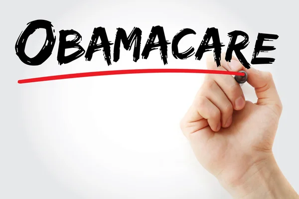 Scrittura a mano Obamacare con pennarello rosso — Foto Stock