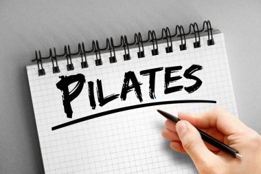 Not defterindeki pilates metni, spor konsepti arka planı