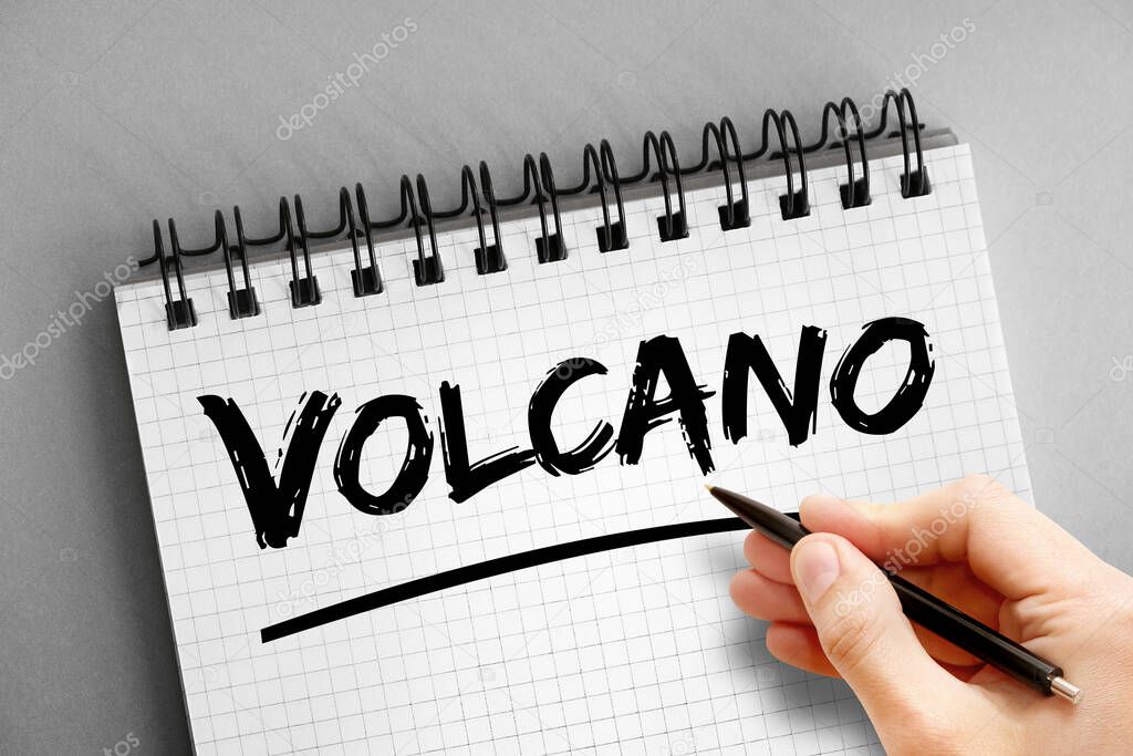 Volcano text on notepad, concept background