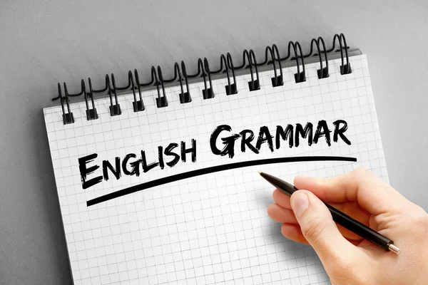 English grammar text on notepad, concept background