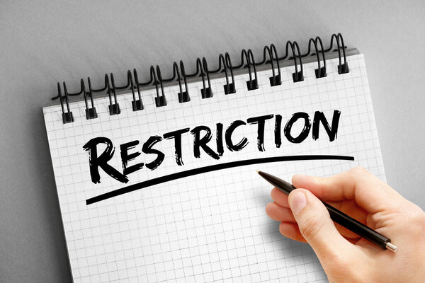 Restriction text on notepad, concept background