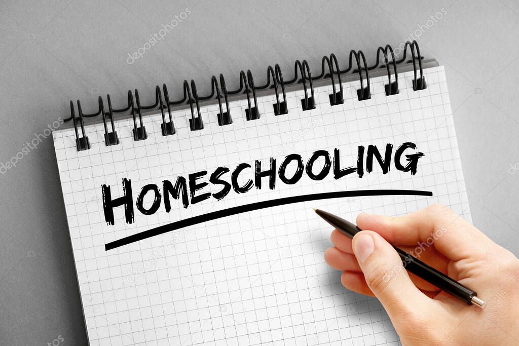 Homeschooling text on notepad, concept background