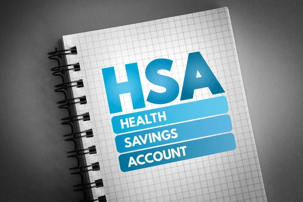 HSA - Health Savings Account acronym on notepad, medical concept background
