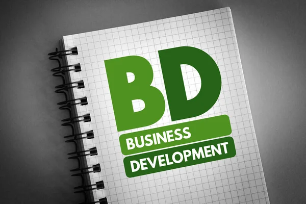 ノートパッドのビジネス開発の頭字語 ビジネスコンセプトの背景 — ストック写真