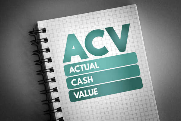 ACV - Actual Cash Value acronym on notepad, business concept backgroun