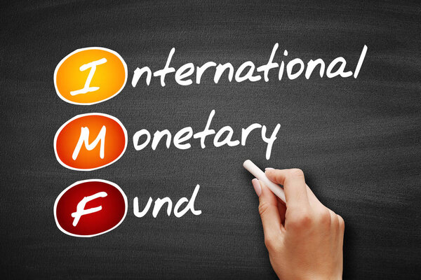 IMF - International Monetary Fund acronym, business concept background on blackboard