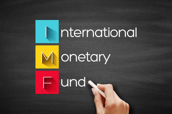 IMF - International Monetary Fund acronym, business concept background on blackboard