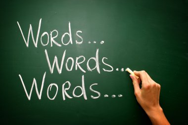 Handwritten with chalk on a blackboard - words.. clipart