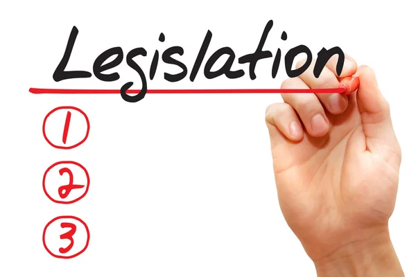 Hand skriva lagstiftning lista, business begreppsmässigt — Stockfoto