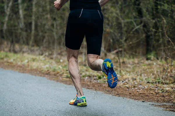 closeup feet of young runner men