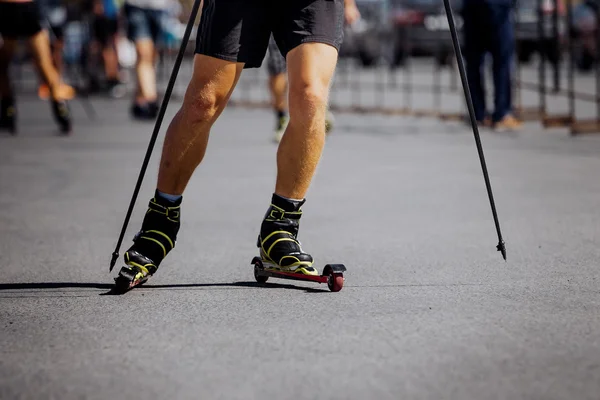 legs men racer in ski-roller