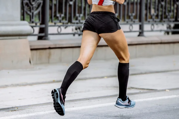 side view of young woman legs in compression socks