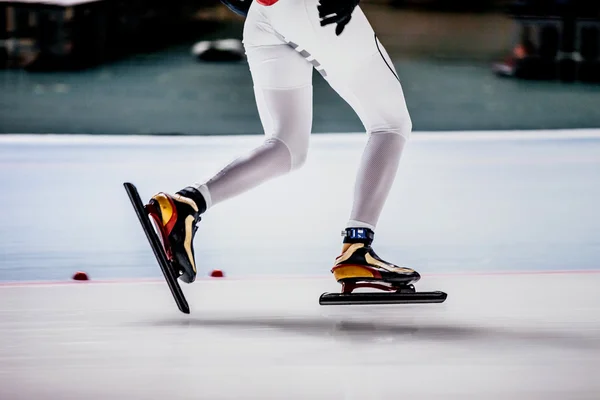 closeup of legs of women speed skaters