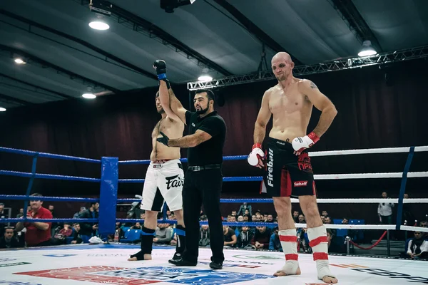 referee announces victory of MMA fighter