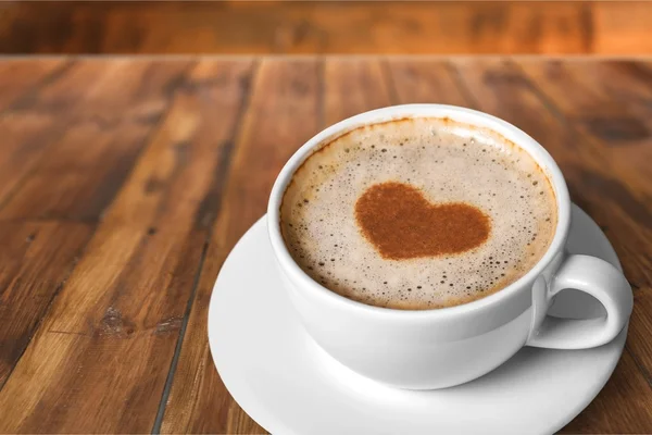 Taza de café en el fondo — Foto de Stock