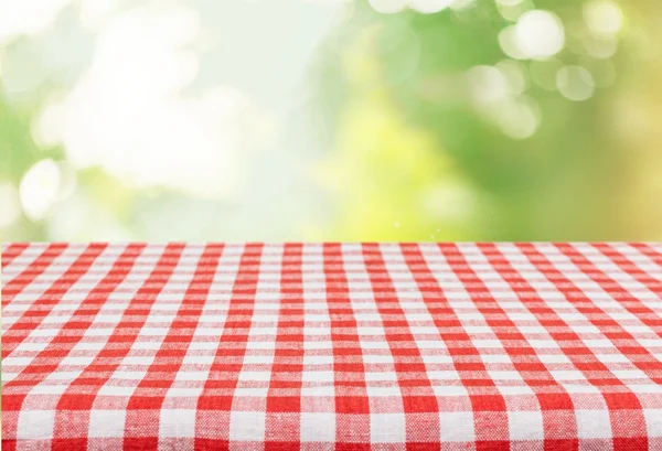 worn table and blur background grass